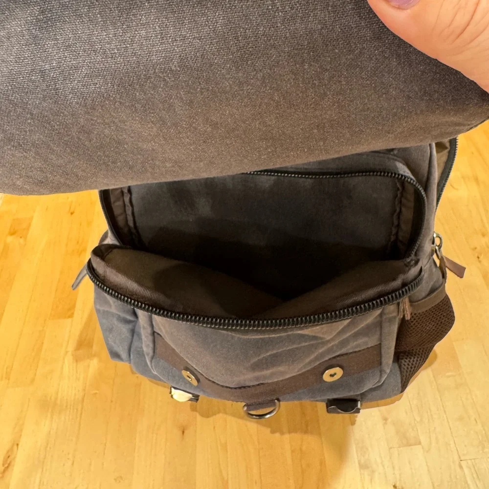 Gray Canvas Crossbody Backpack with Brown Accents Multiple Compartments Durable